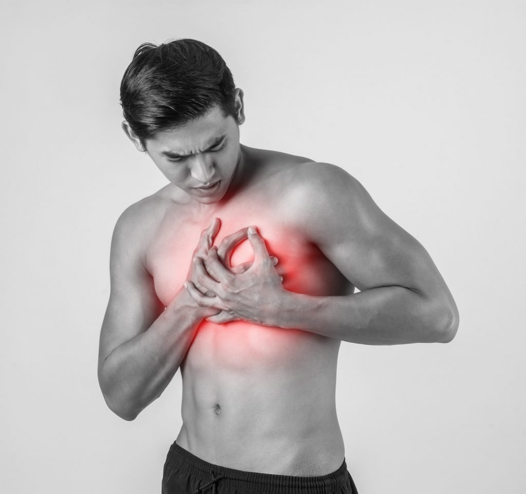 young man has heart attack isolated white background 1